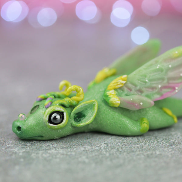 Green and Yellow Bored Dragon Figurine
