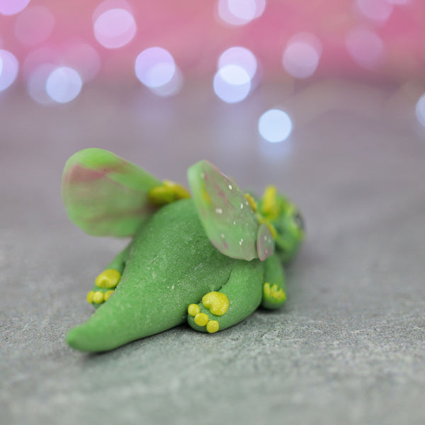 Green and Yellow Bored Dragon Figurine