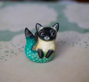 Yellow and teal siamese merkitty figurine