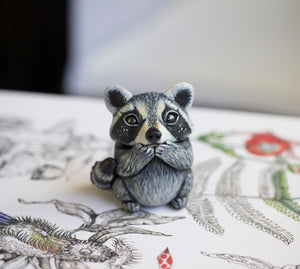 Lavender raccoon figurine