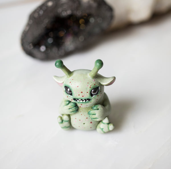 Alien baby figurine