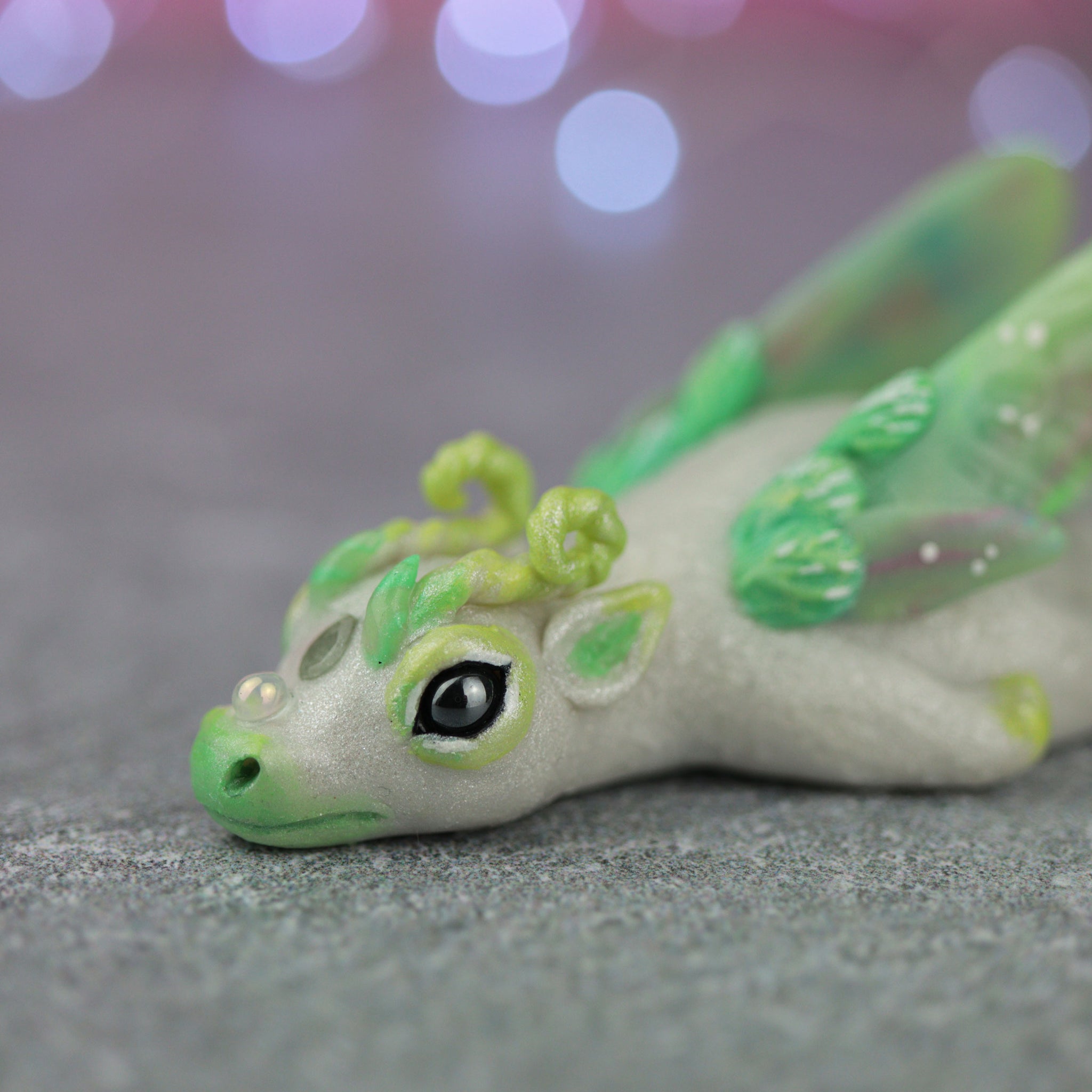 White and Green Bored Dragon Figurine